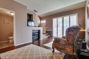 High ceilings, distressed hardwood floors, slider to your patio or California Room!